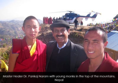 Master Healer  Pankaj Naram with young monks in the top of the mountains, Nepal